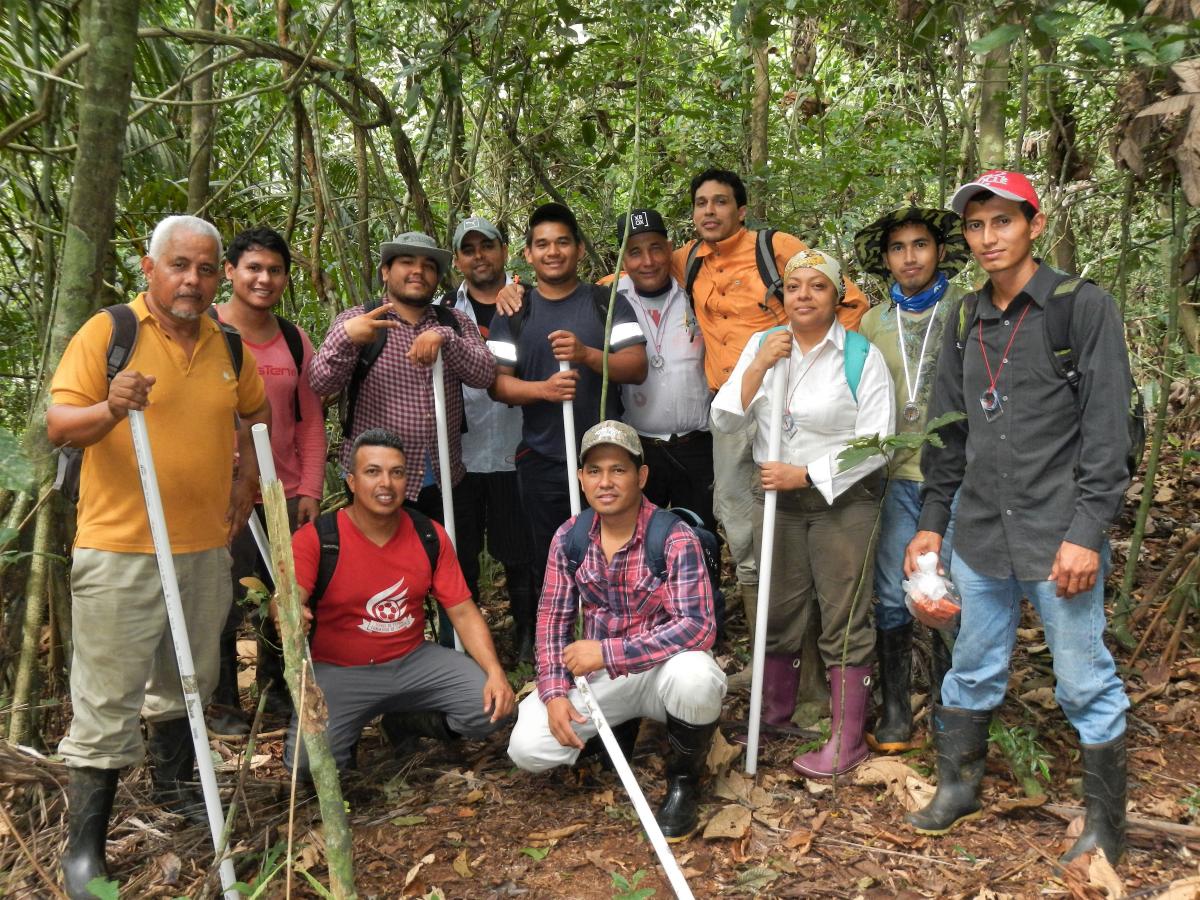 Group photo of field team in tropical forest.